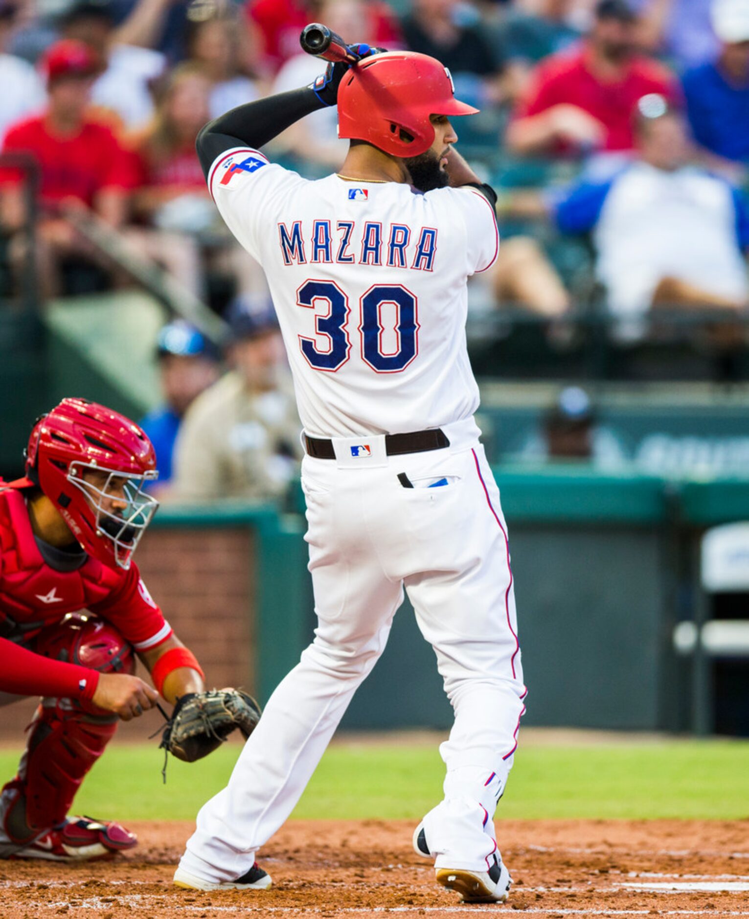 Texas Rangers right fielder Nomar Mazara (30) bats during the first inning of an MLB game...