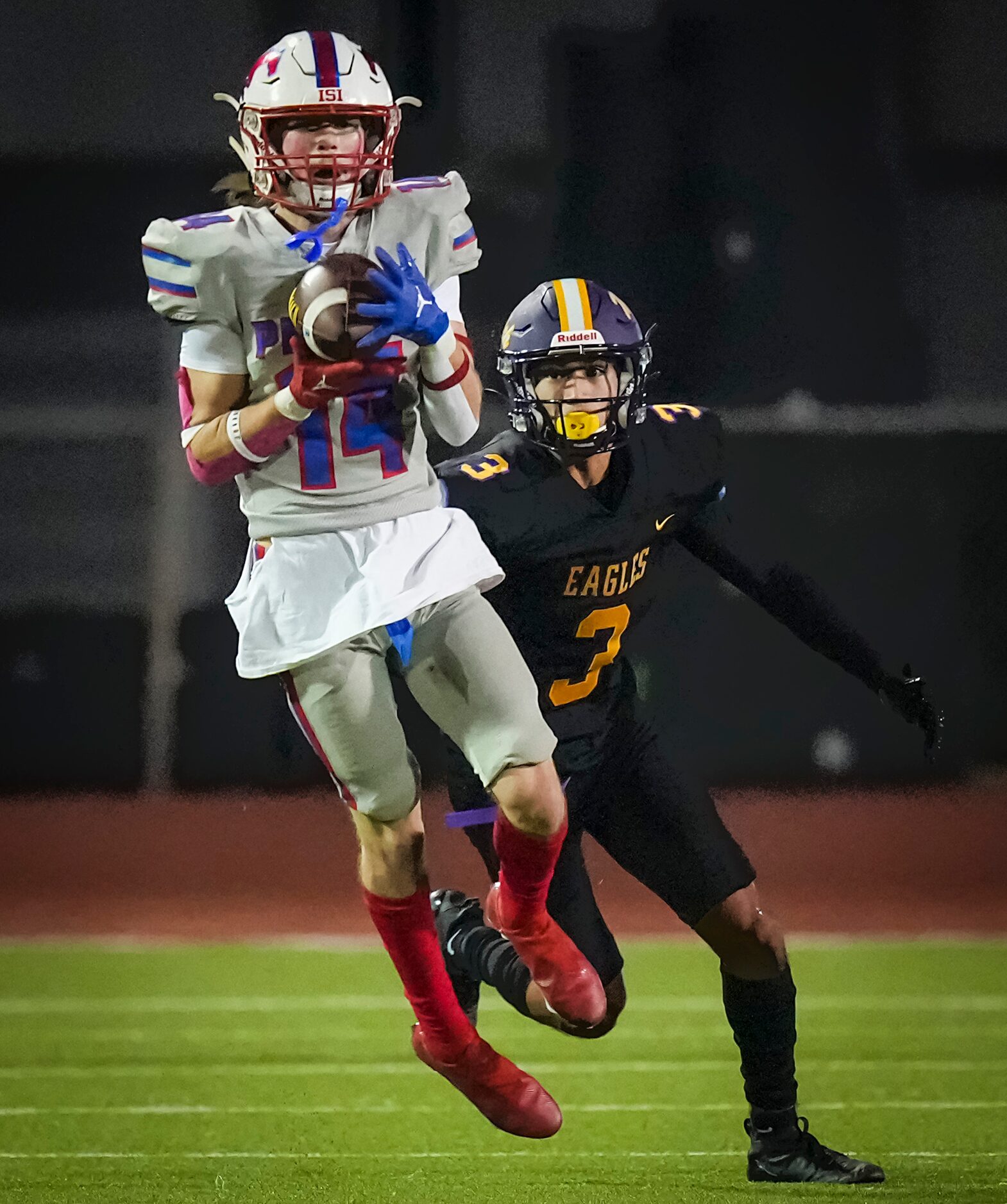 Richardson Pearce defensive back Tate Navin (14) intercepts a pass intended for Richardson’s...