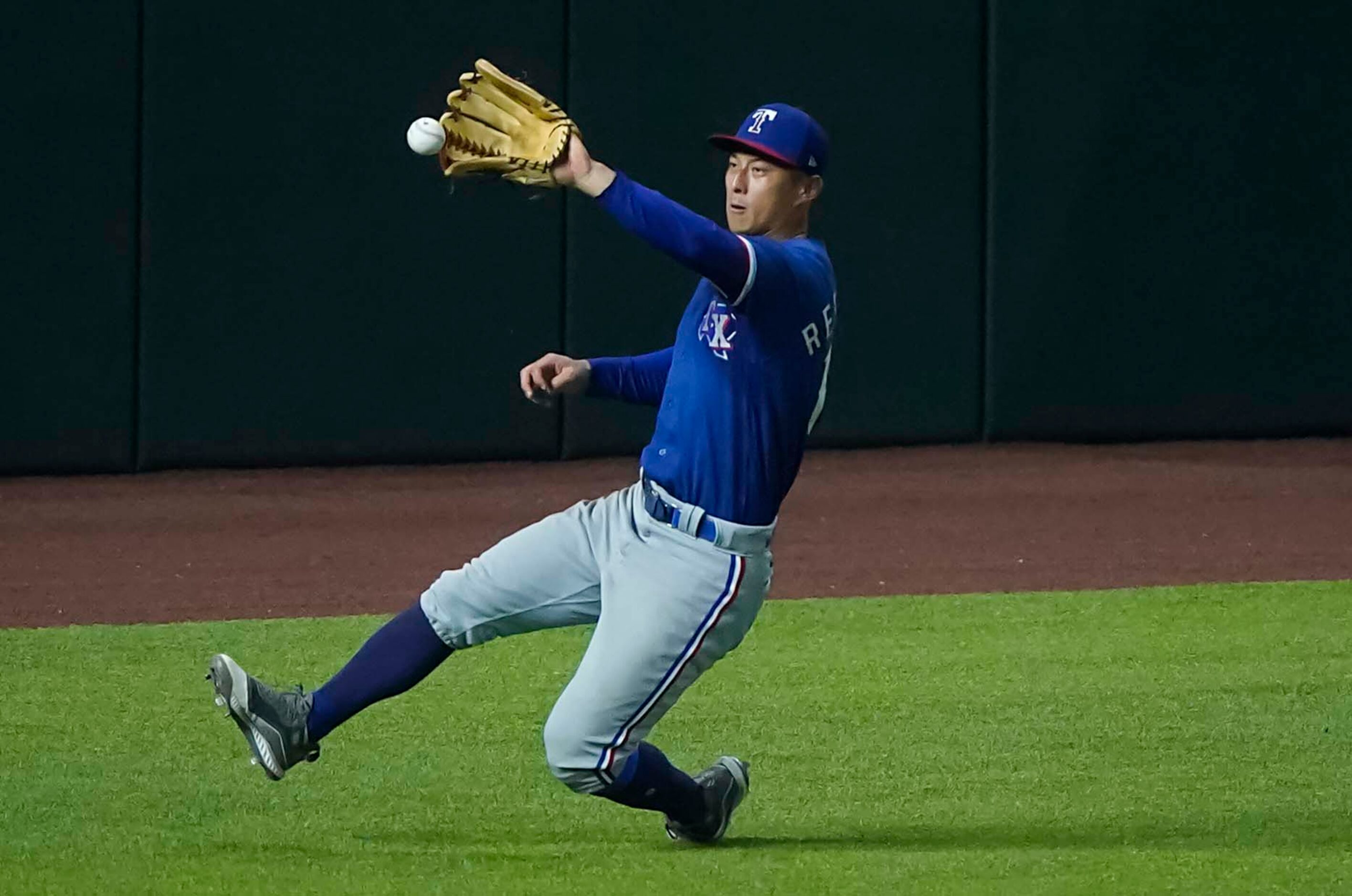 Outfielder Rob Refsnyder chases down a double off the bat of Scott Heineman in an intrasquad...