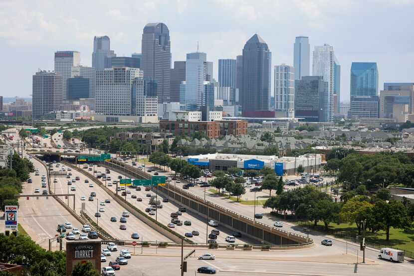 Traffic passes along U.S. Route 75 overlooking the Dallas skyline on May 30.