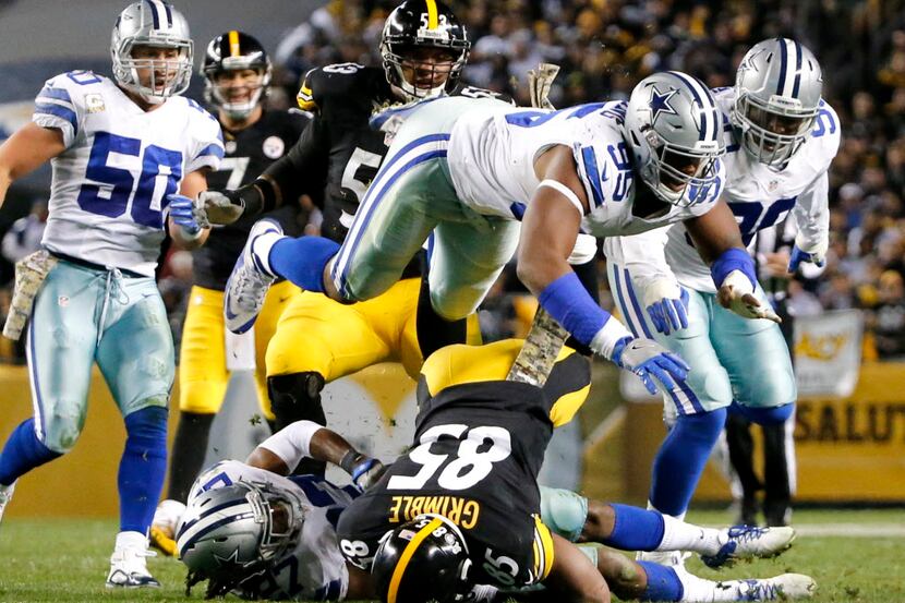 Dallas Cowboys defensive tackle David Irving (95) jumps over Pittsburgh Steelers tight end...