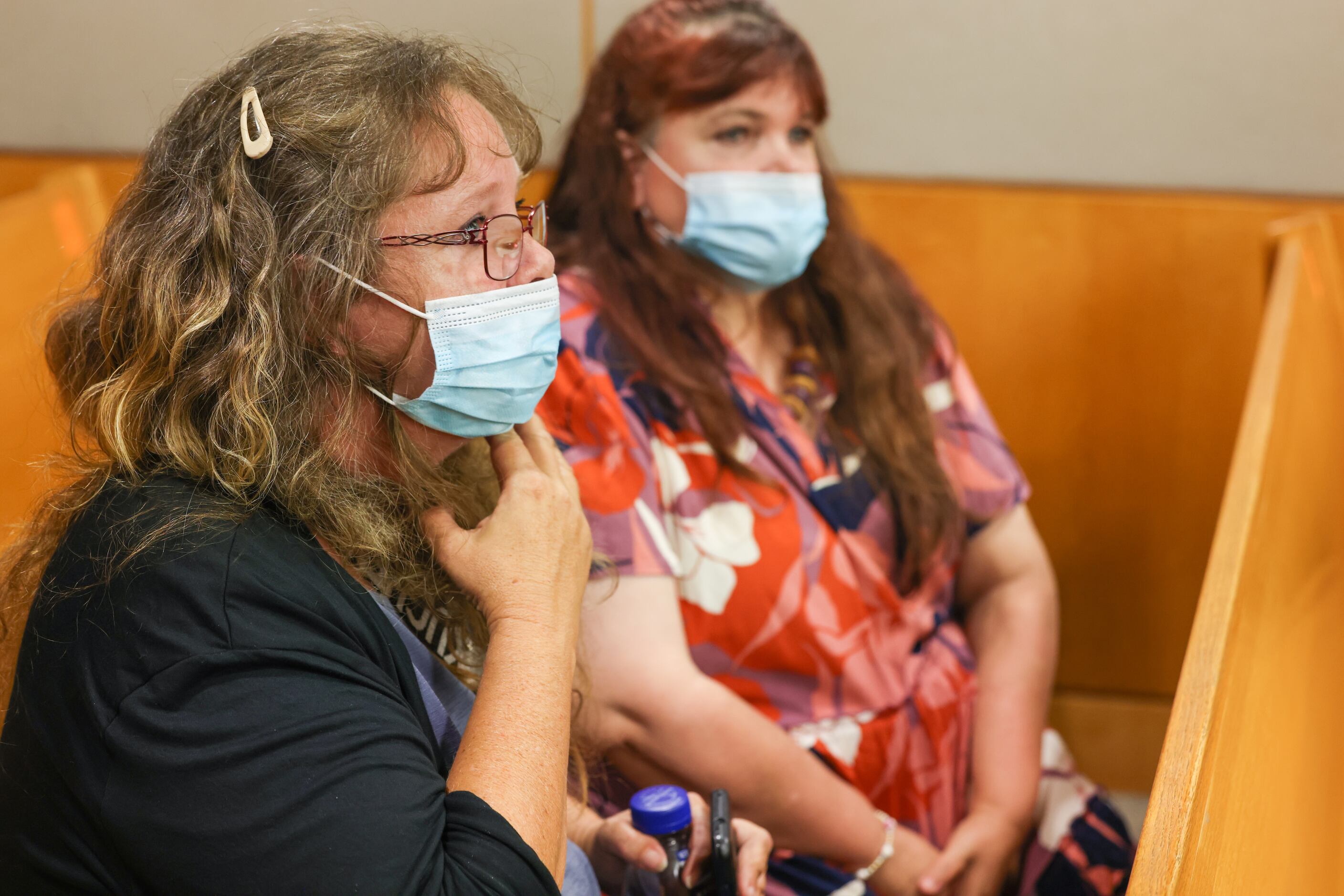 Connie Moggio (left) and Patricia Owens sit in the courtroom after giving victim impact...