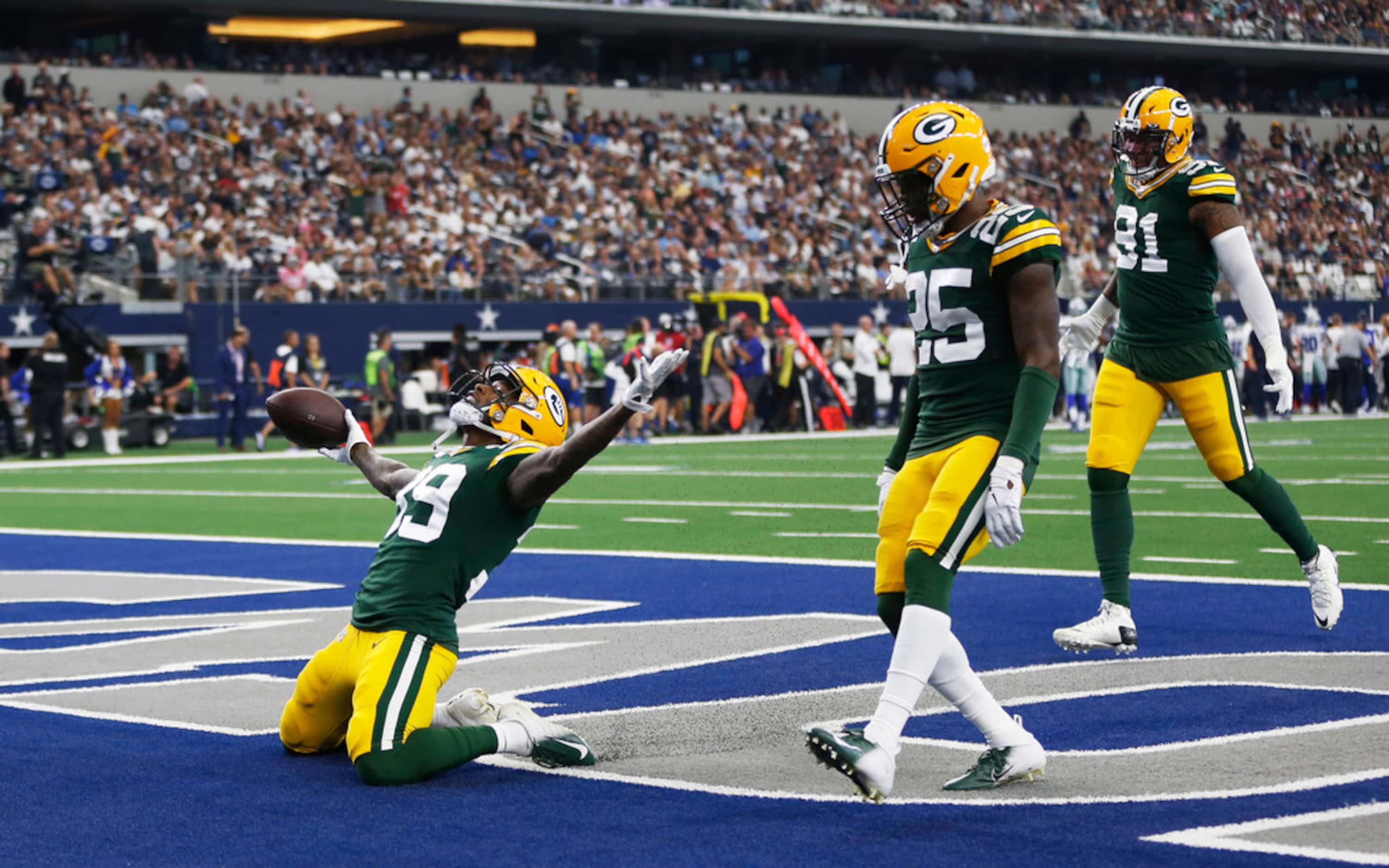 Green Bay Packers defensive back Chandon Sullivan (39) slides into the end zone as he...