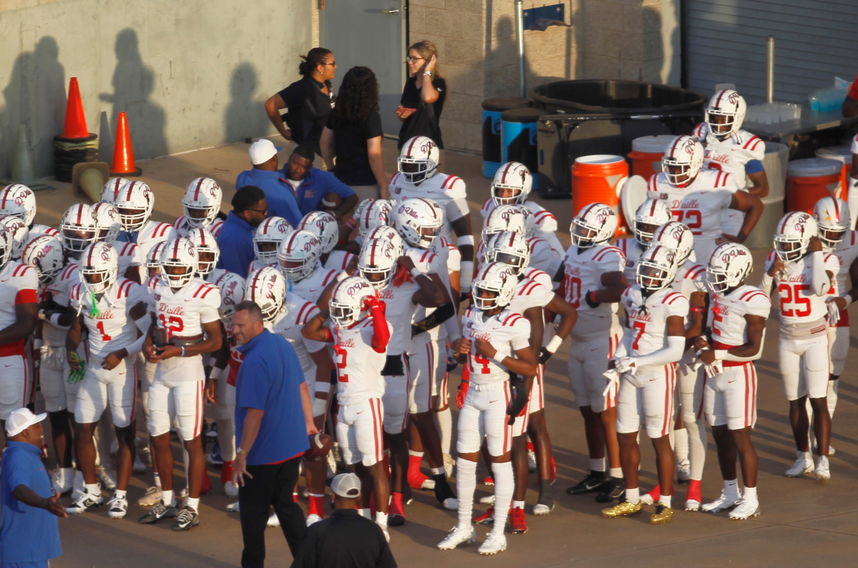 Duncanville players emerge from the locker room following a lightning delay before the...