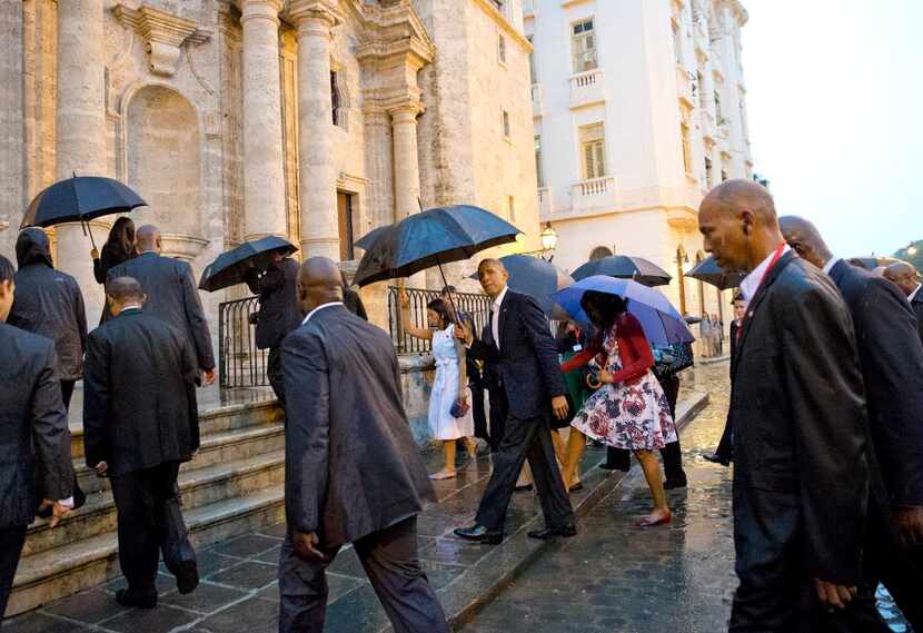  President Barack Obama and his family toured Old Havana on foot on a rainy Sunday...