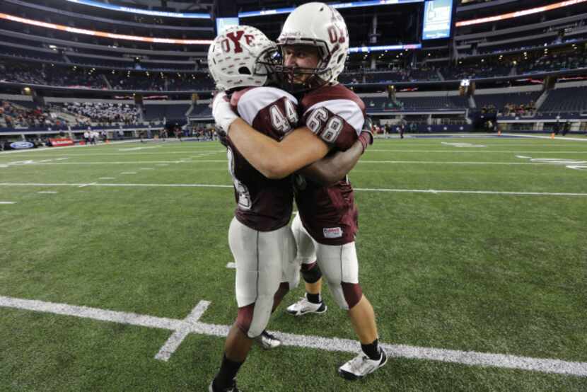 Cameron Yoe's Casey Greene (44) and Joshua Stubbs (68) after winning the Class 2A Division I...