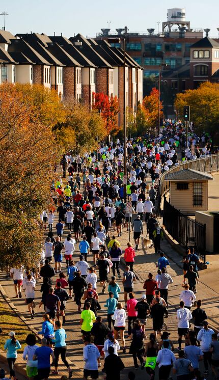 Runners filled eastbound Young Street after starting the 8-mile run during the 49th annual...