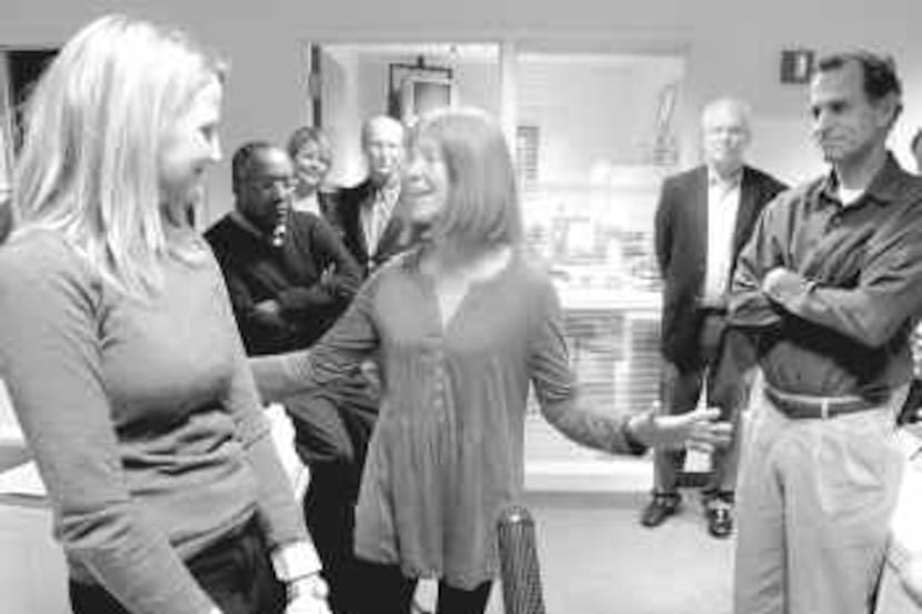  Pulitzer-winning editorial writer Colleen McCain Nelson (left) listens as deputy editorial...