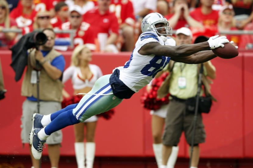 Dallas Cowboys wide receiver Dez Bryant (88) dives for a catch in a game against the Kansas...