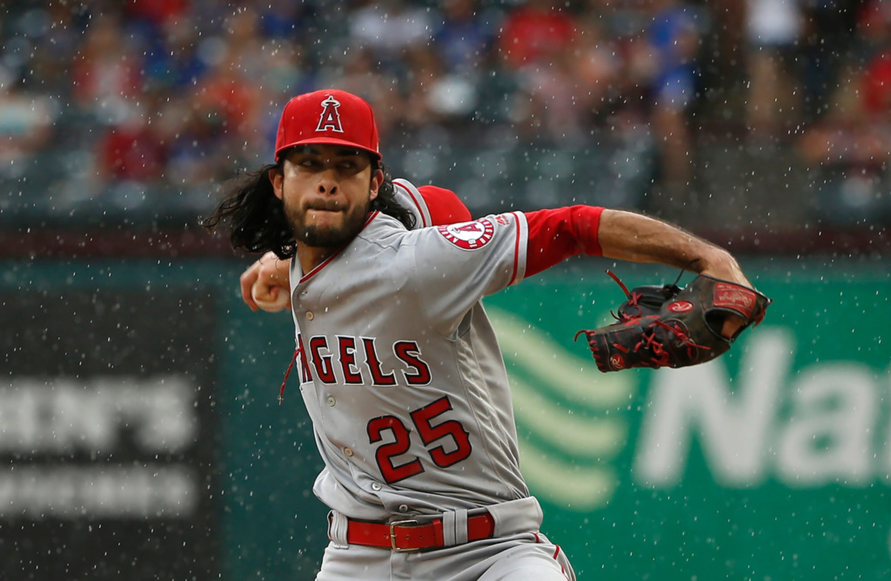 ARLINGTON, TX - AUGUST 19: Noe Ramirez #25 of the Los Angeles Angels of Anaheim throws...