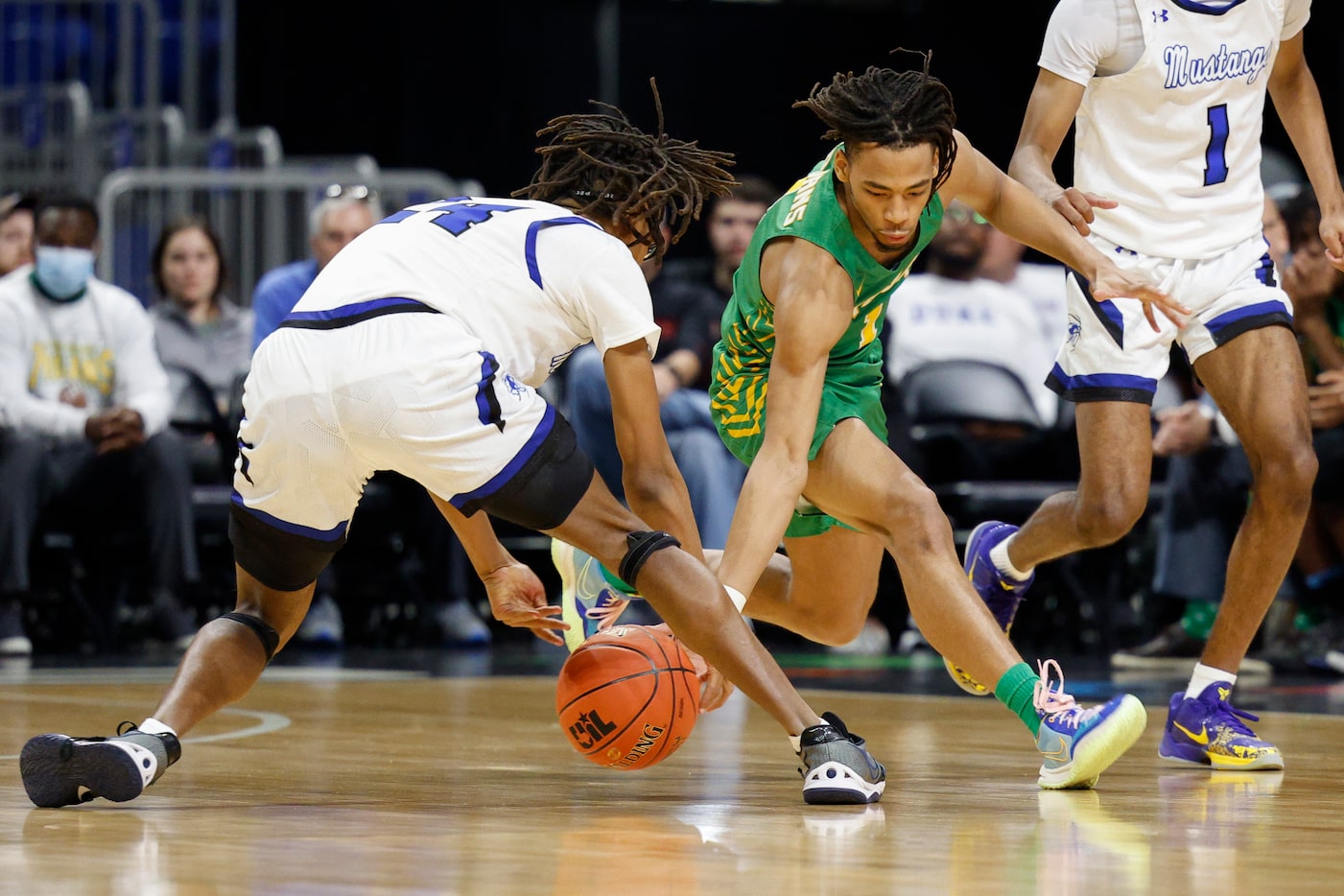 Madison guard Pierre Hunter (1) knocks the ball loose from Wichita Falls City View guard...