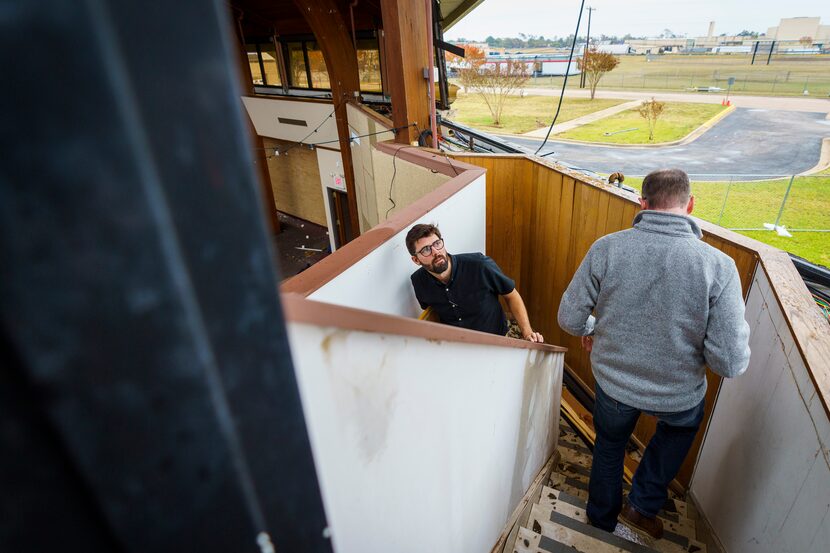 Architect Brandon Coates, center, and lead pastor Shea Sumlin survey damage to Northway...