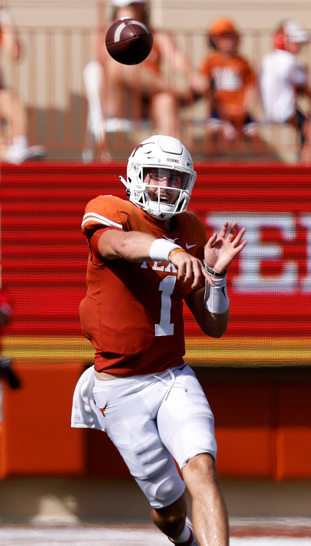 Texas Longhorns quarterback Hudson Card (1) throws a pass downfield lagainst the...