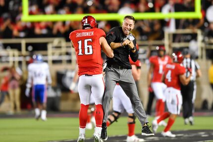 LUBBOCK, TX - SEPTEMBER 29: Nic Shimonek #16 of the Texas Tech Red Raiders and head coach...