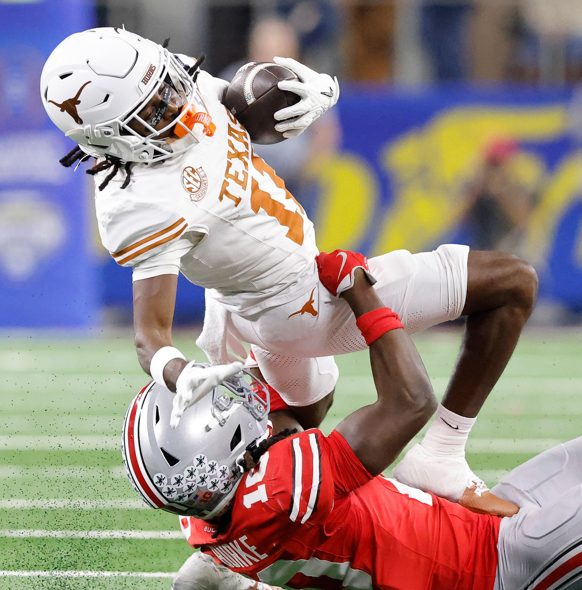 Texas Longhorns wide receiver Silas Bolden (11) is spun down by Ohio State Buckeyes...