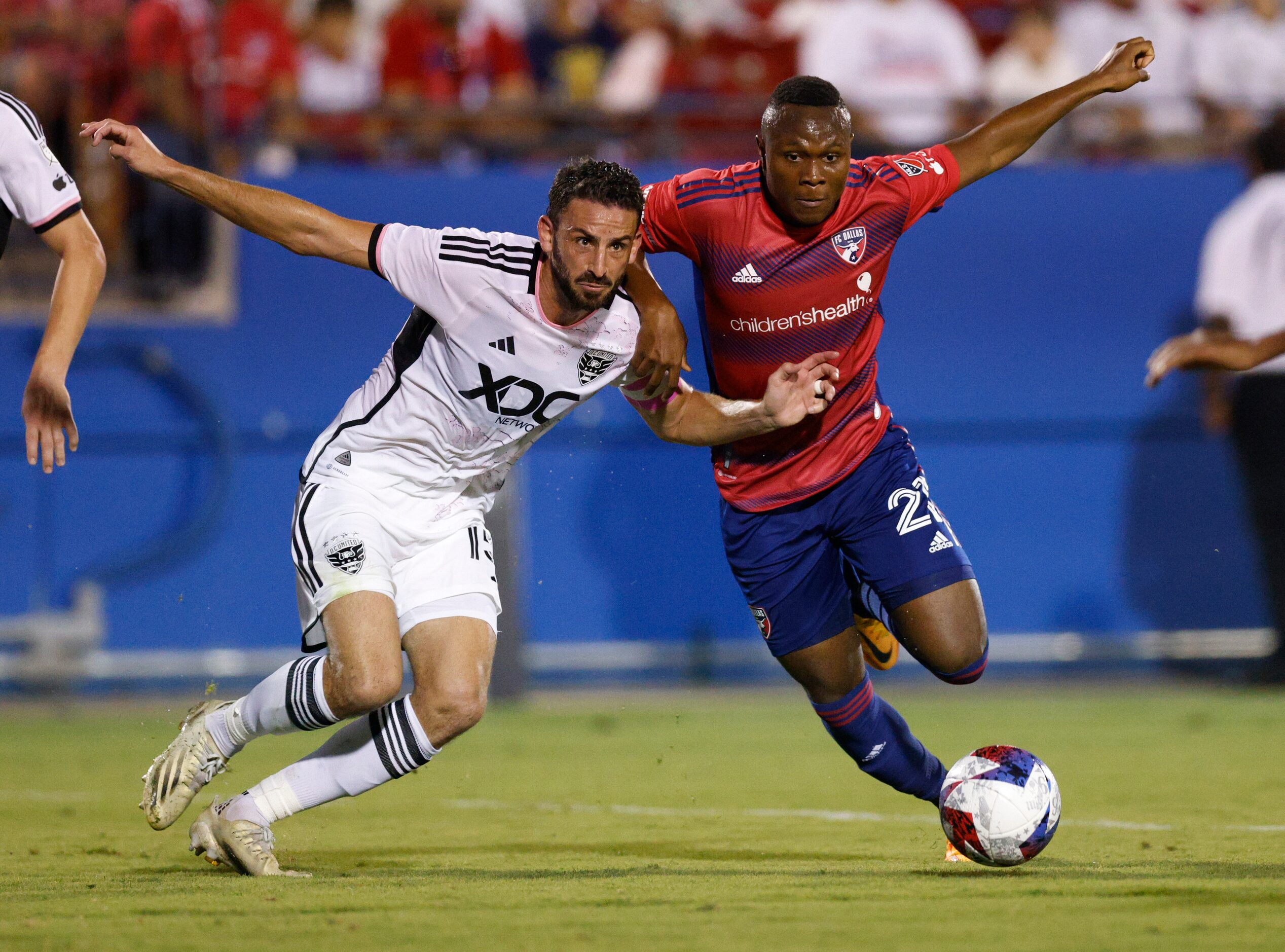 D.C. United defender Steve Birnbaum (15) tries to push FC Dallas forward José Mulato (21)...