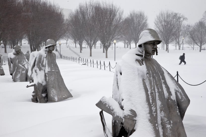 The Korean War Veterans Memorial in the snow, Saturday, Jan. 23, 2016 in Washington. (AP...