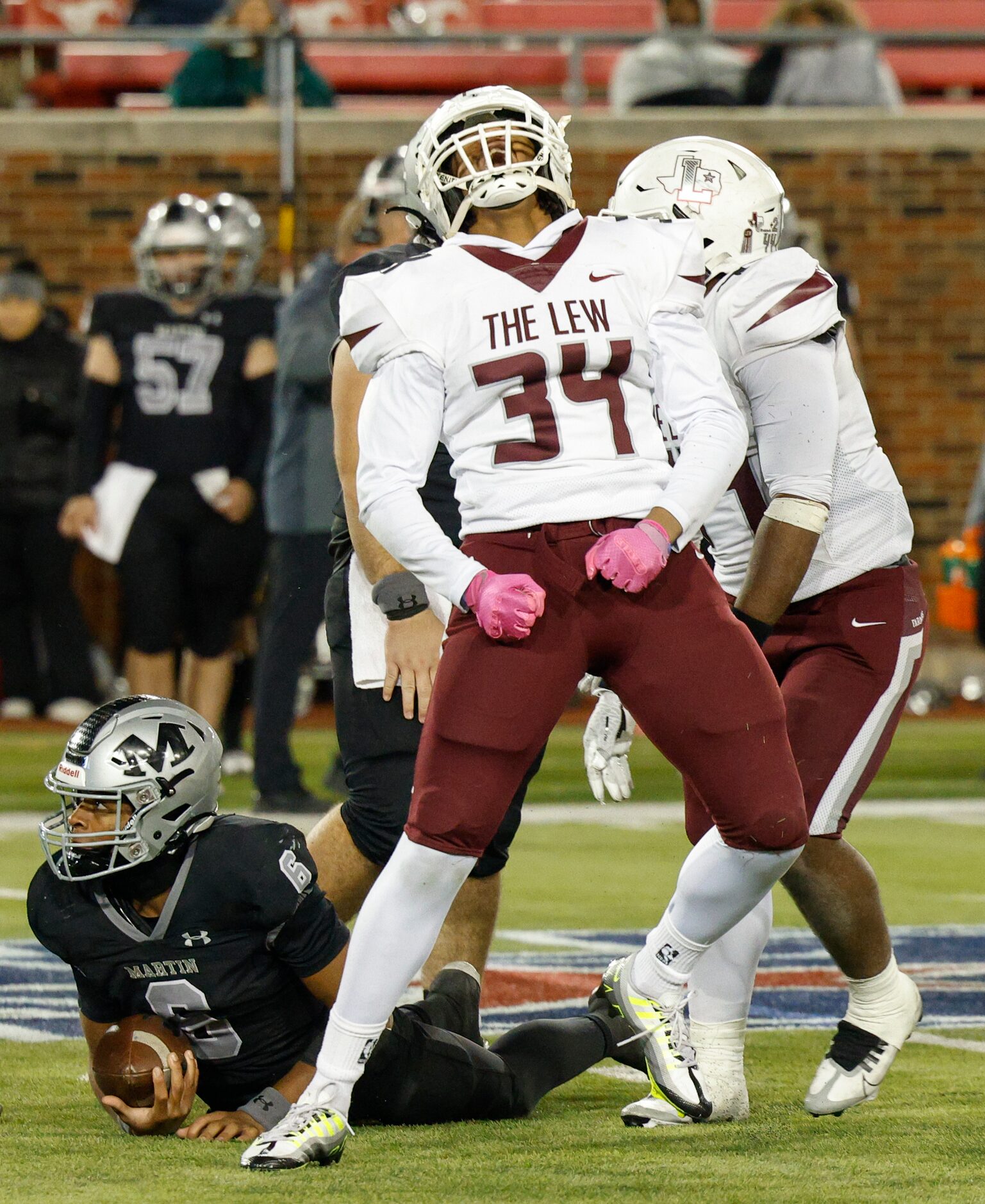 Lewisville defensive lineman Sean Oliver (34) celebrates after sacking Arlington Martin...