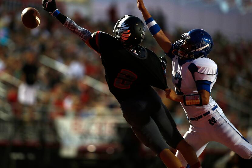 Fort Worth Nolan's Jose Torres (3) tries to block a pas to Argyle's Hunter Treadwell (8)...