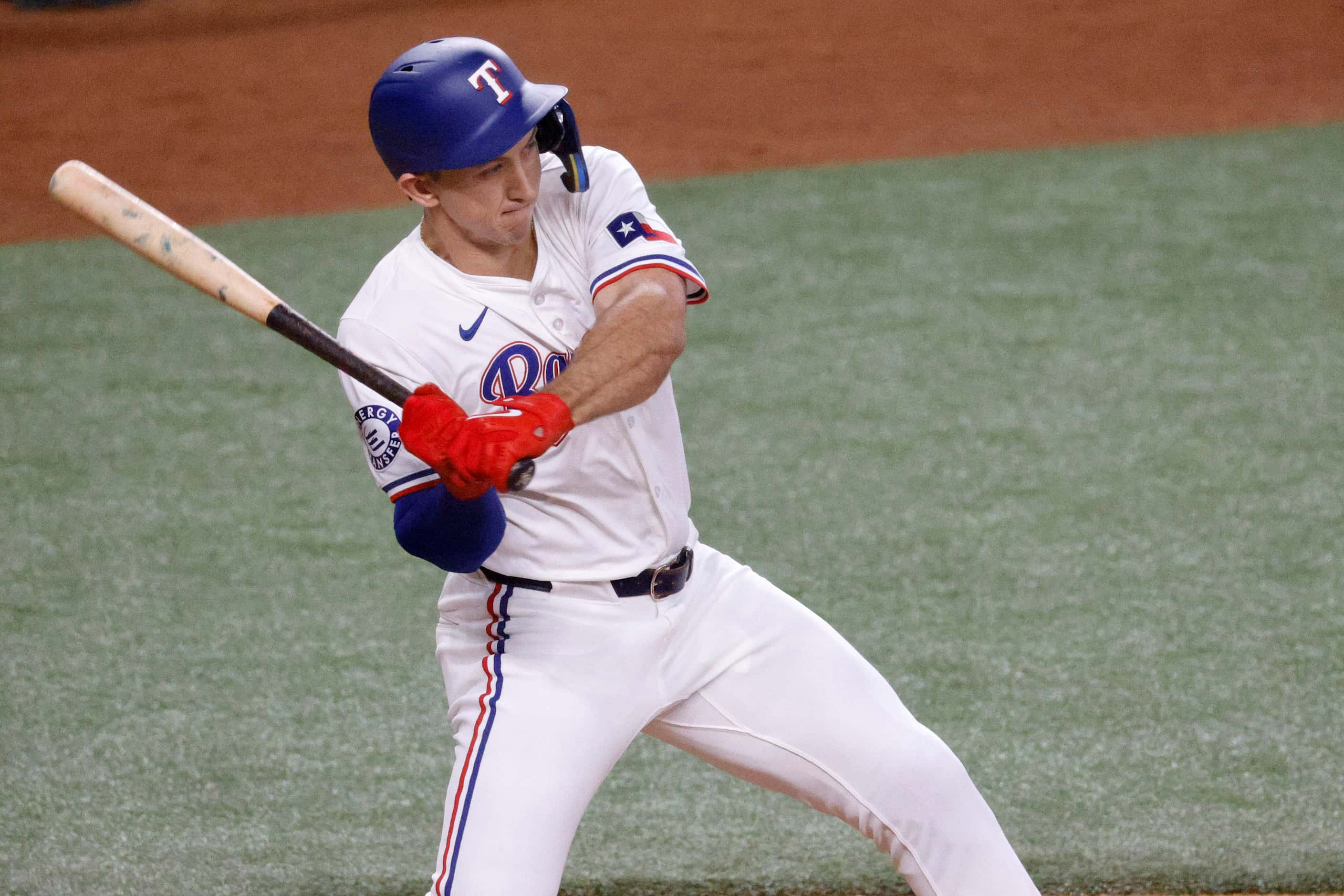 Texas Rangers outfielder Wyatt Langford (36) swings during the first inning of a baseball...