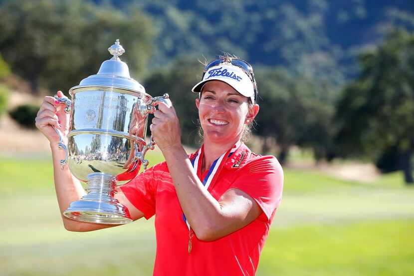 SAN MARTIN, CA - JULY 10:  Brittany Lang poses with the trophy on the 18th green after...
