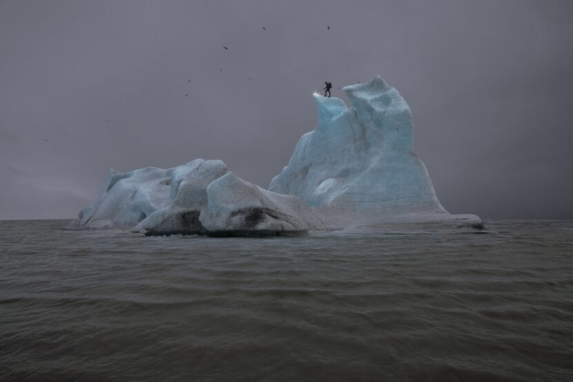 In Julian Charrière's 2013 photo "The Blue Fossil Entropic Stories III," the artist stands...