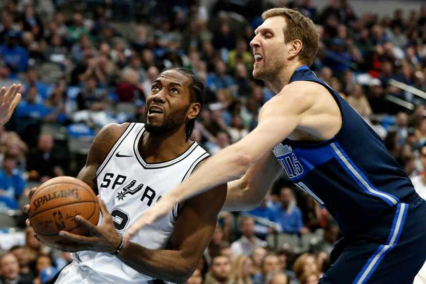 San Antonio Spurs forward Kawhi Leonard (2) drives to the basket as Dallas Mavericks forward...