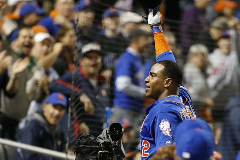 FILE- In this Oct. 12, 2015, file photo, New York Mets' Yoenis Cespedes takes a curtain call...