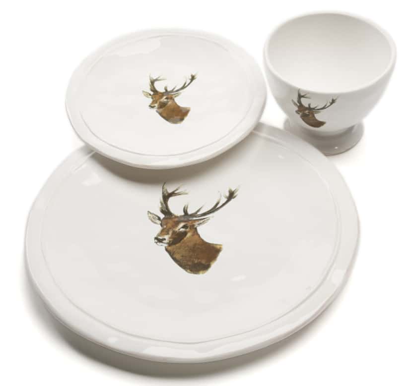 Reindeer run: Rustic dinnerware featuring a majestic reindeer brings the beauty of nature to...