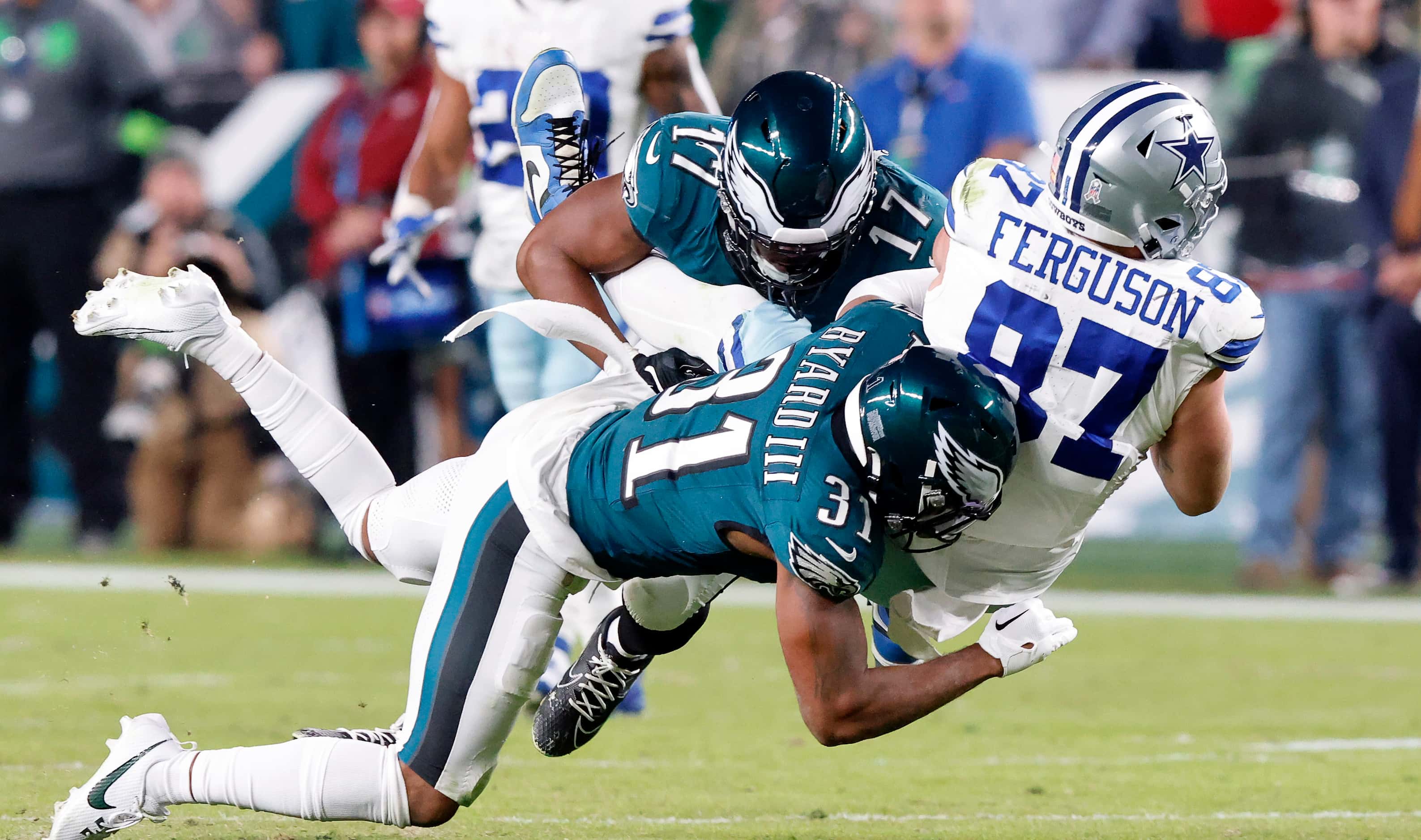 Dallas Cowboys tight end Jake Ferguson (87) caches a second quarter pops as he’s tackled by...