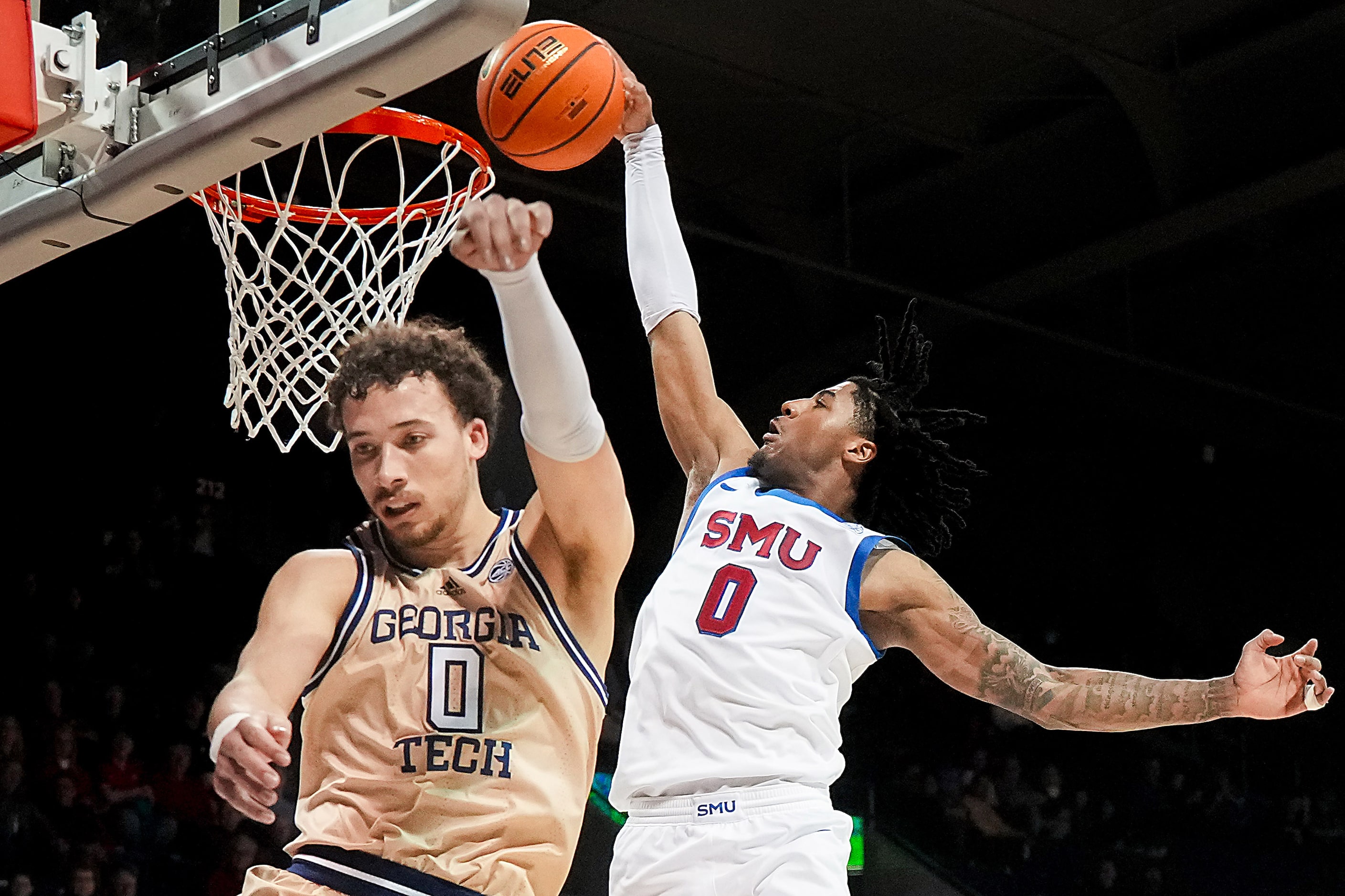 SMU guard B.J. Edwards dunks the ball over Georgia Tech guard Lance Terry during the second...