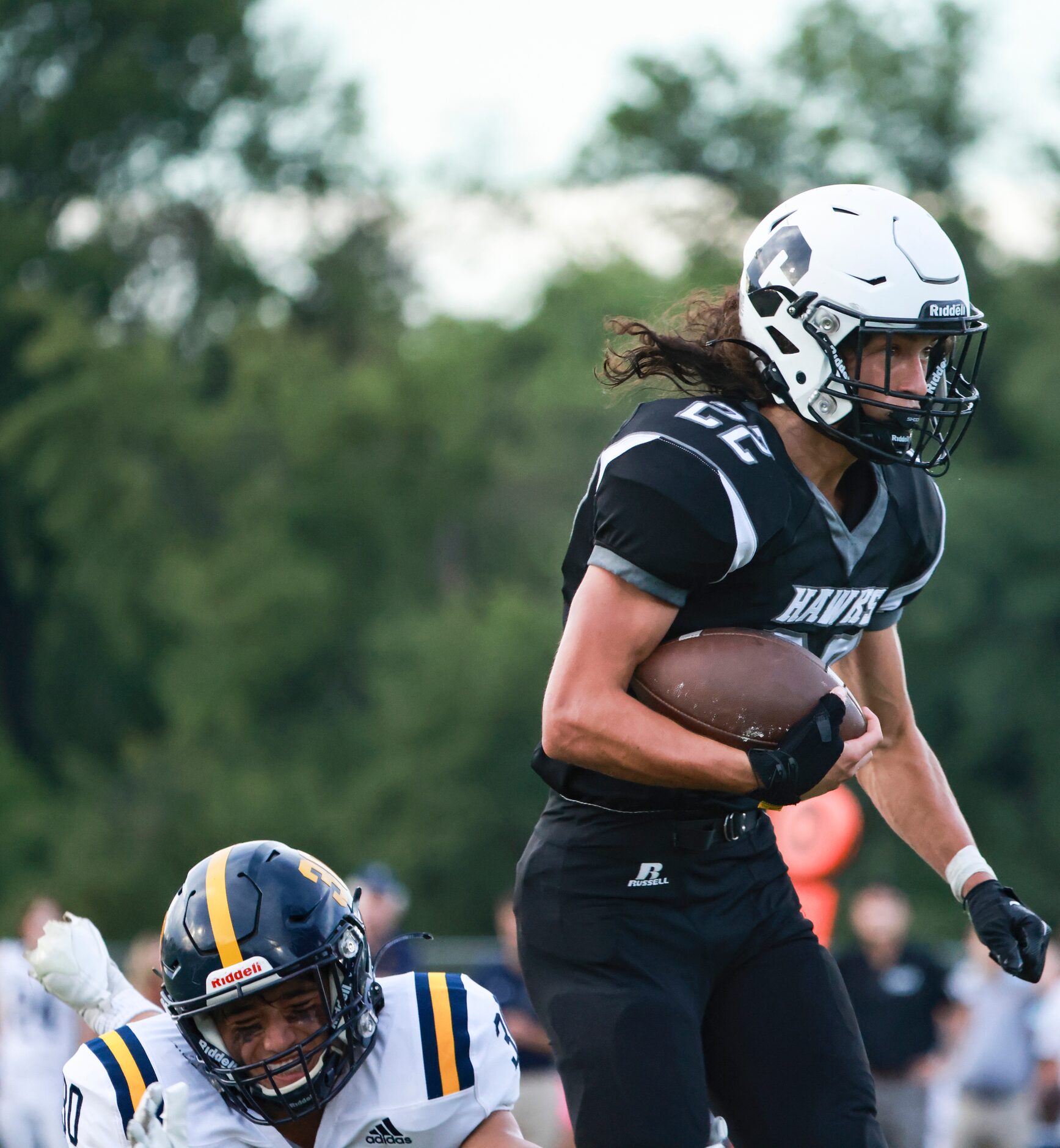 St. Mark's School of Texas Silas Hosler (30) grabs the foot of Cistercian Preparatory School...