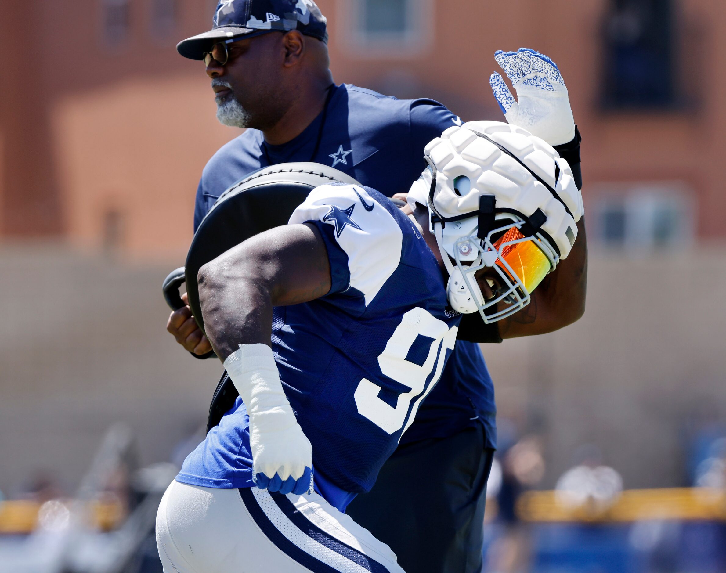 Dallas Cowboys defensive end Demarcus Lawrence (90) runs through pass rush drills during...