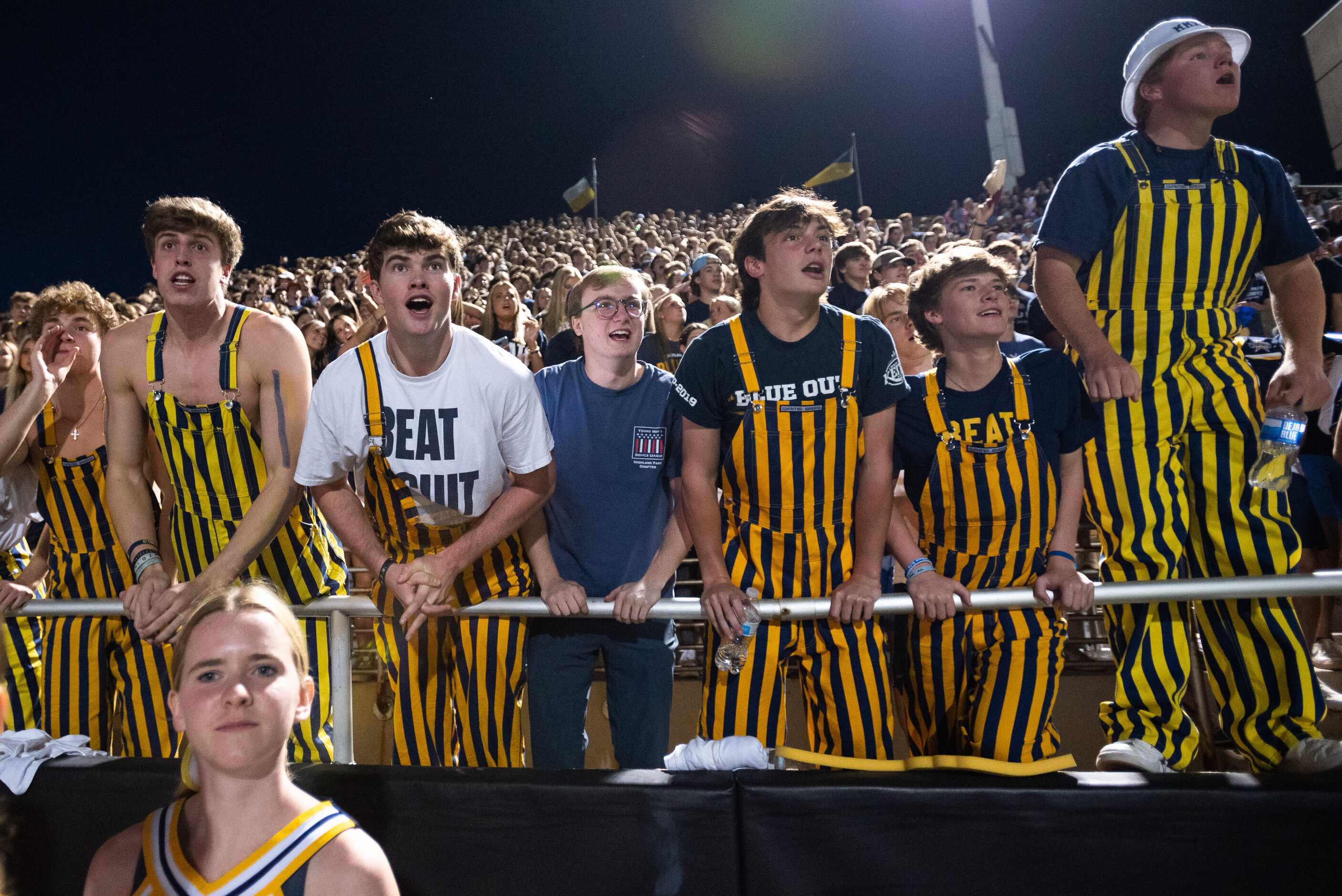 Highland Park students watch the closing moments of the first half during a Friday night...