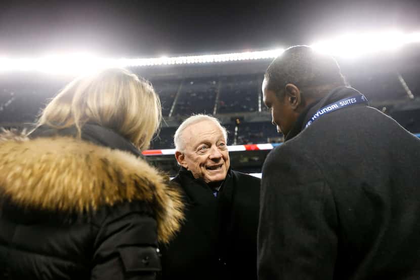 Cowboys owner Jerry Jones speaks with people on the sidelines prior to a game against the...