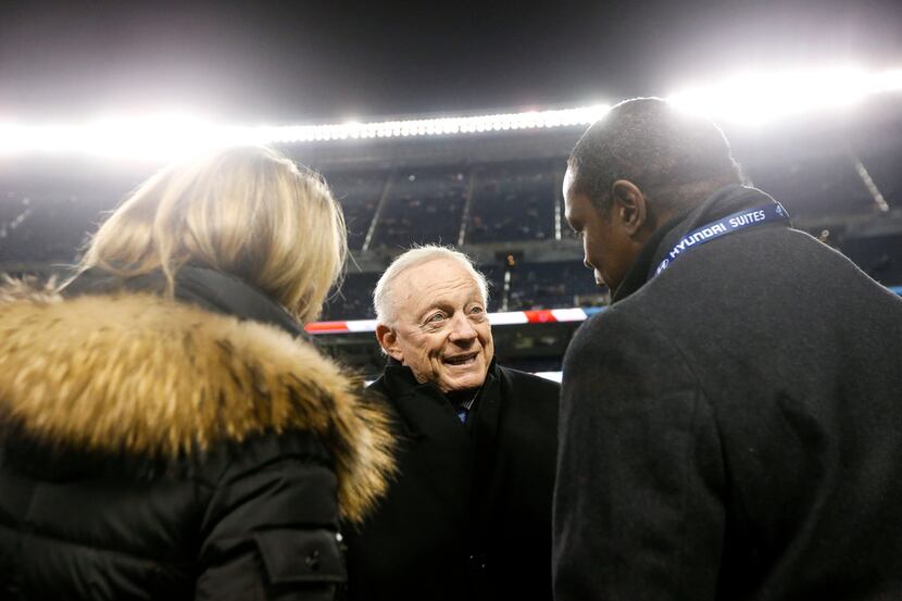 Cowboys owner Jerry Jones speaks with people on the sidelines prior to a game against the...