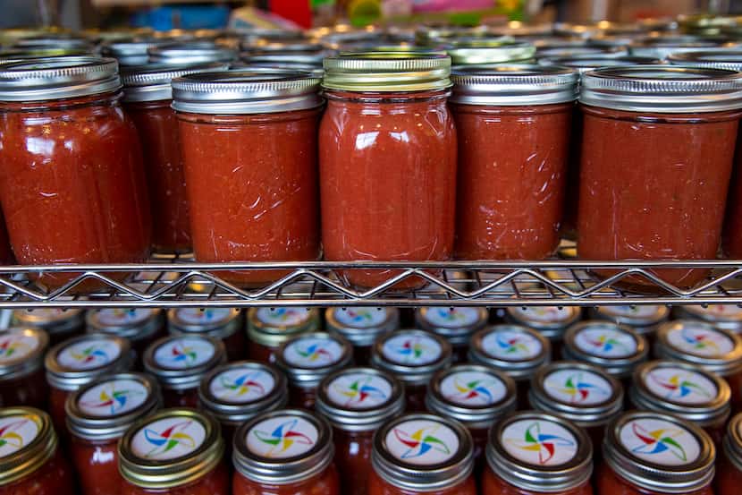 Lynn Davis makes jars of salsa for his employees at Dallas Children's Advocacy Center.