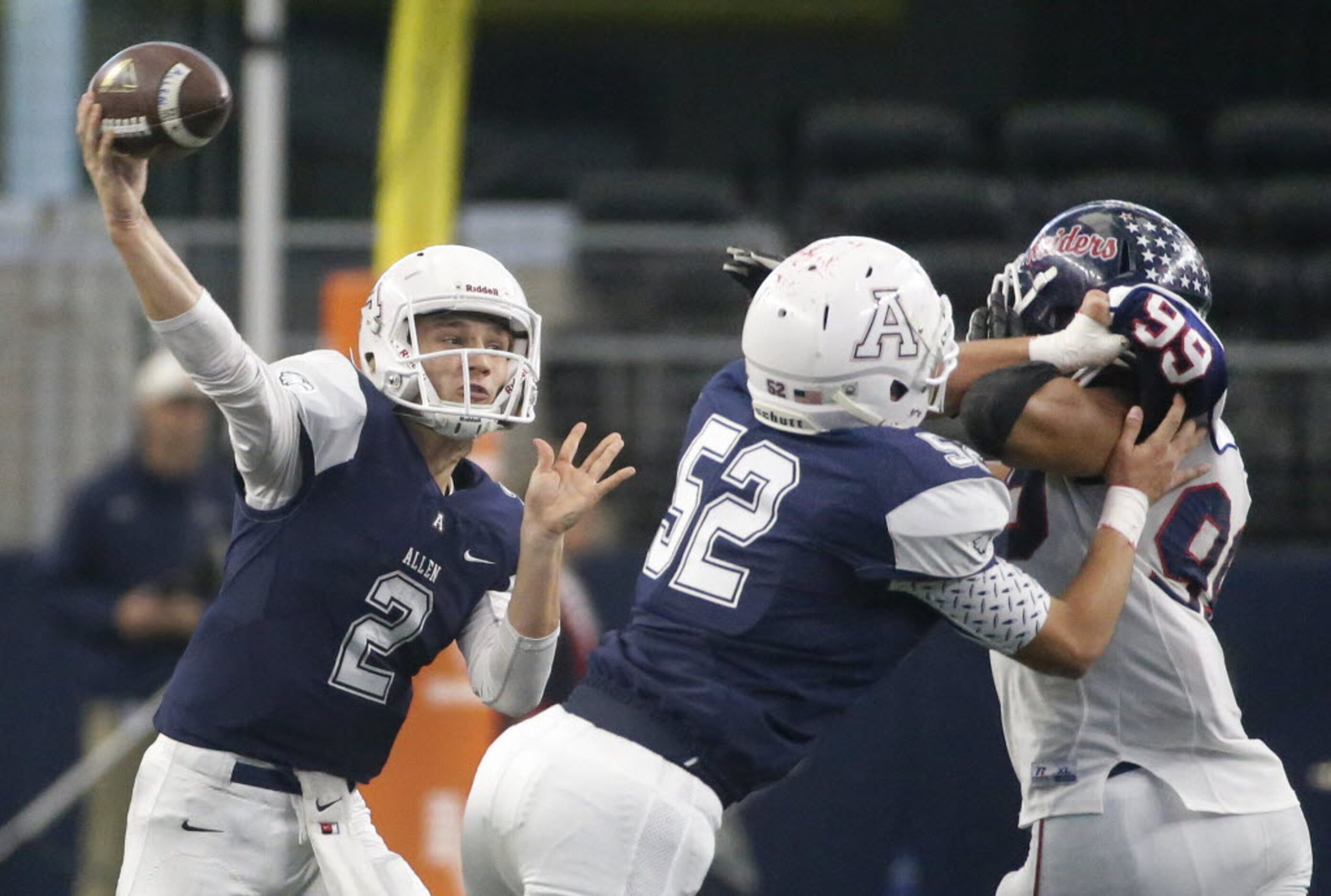 Allen quarterback Mitchell Jonke (2) throws a pass behind the block of Mason Norris (52)...