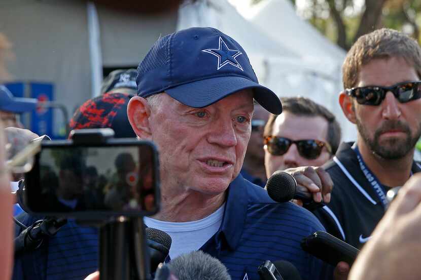 Dallas Cowboys owner Jerry Jones talks with the media after practice at the training camp in...