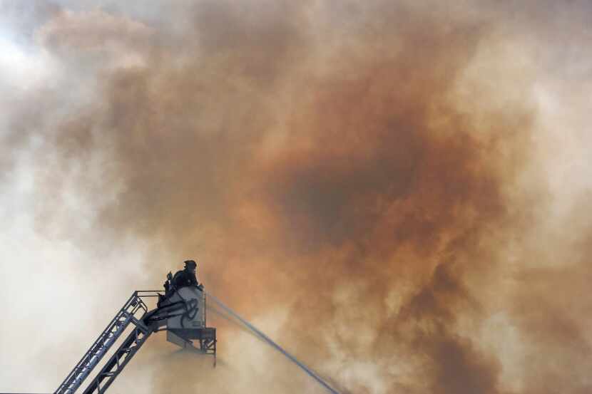 Firefighters battle a blaze at the Appleseed Academy in Mesquite on Wednesday, May 3, 2017....