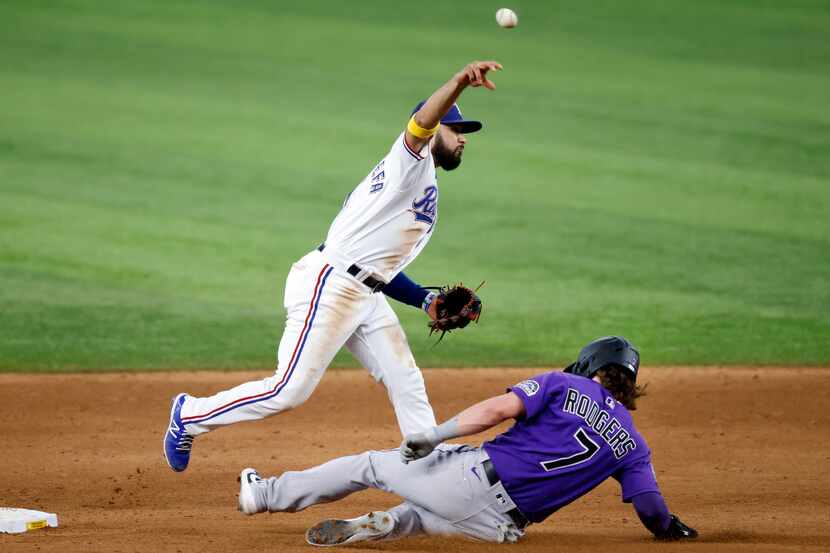 Texas Ranger shortstop Isiah Kiner-Falefa (9) turns the front end of an attempted double...