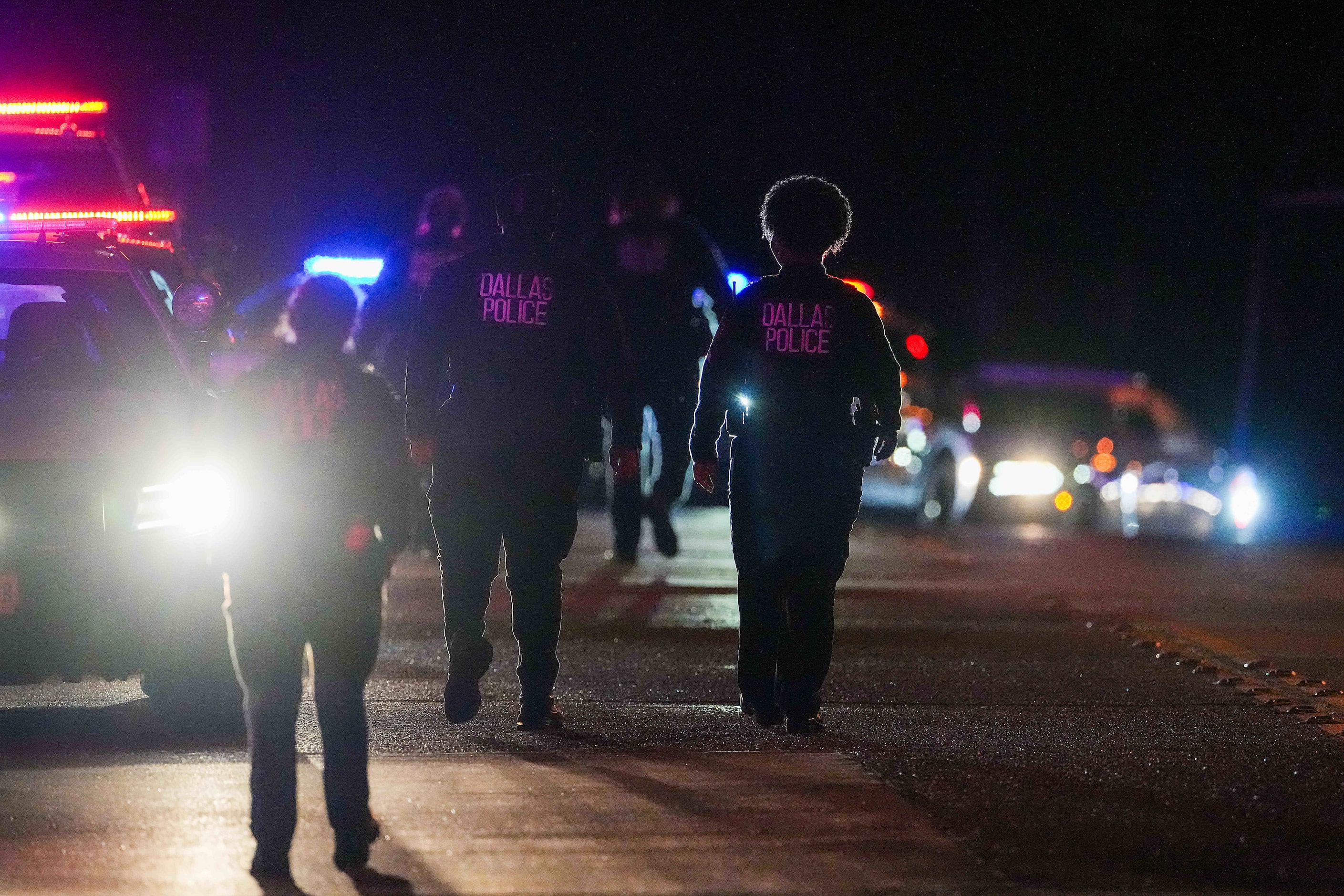 Dallas police stage for a procession from Methodist Dallas Medical Center to the medical...