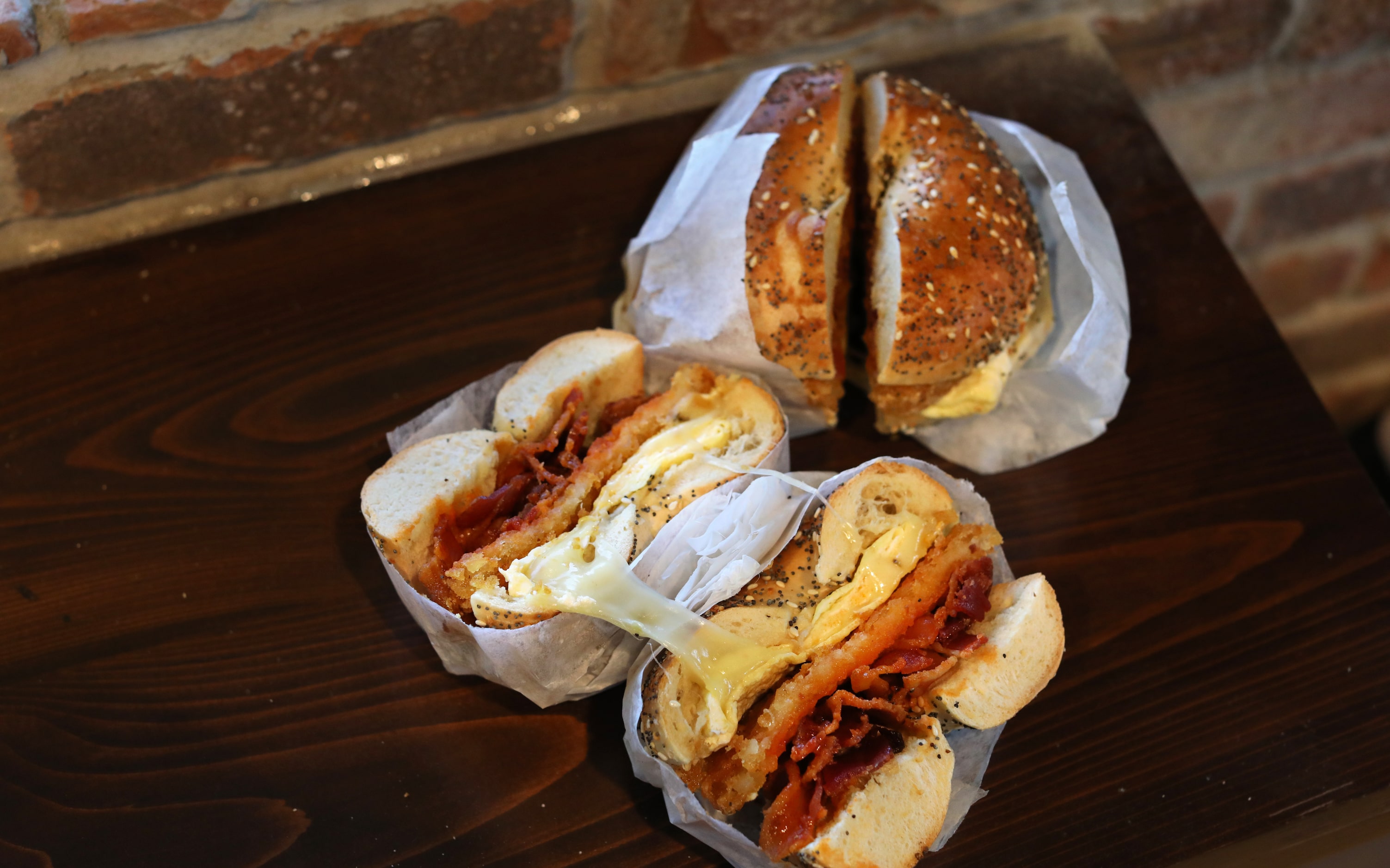 Everything bagels are a popular start to the egg sandwiches at Shug's Bagels in Dallas, TX,...