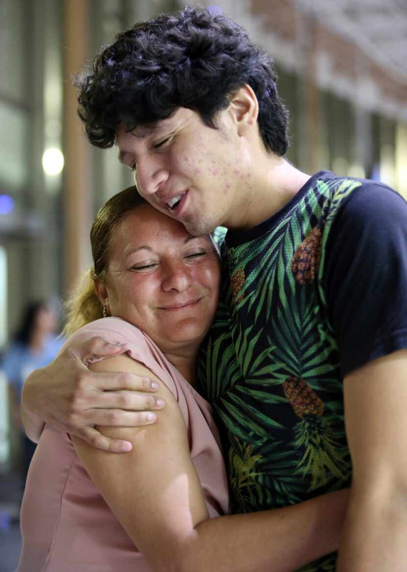 Francisco Galicia embraces his mother, Sanjuana Galicia, on Wednesday in McAllen. Galicia,...