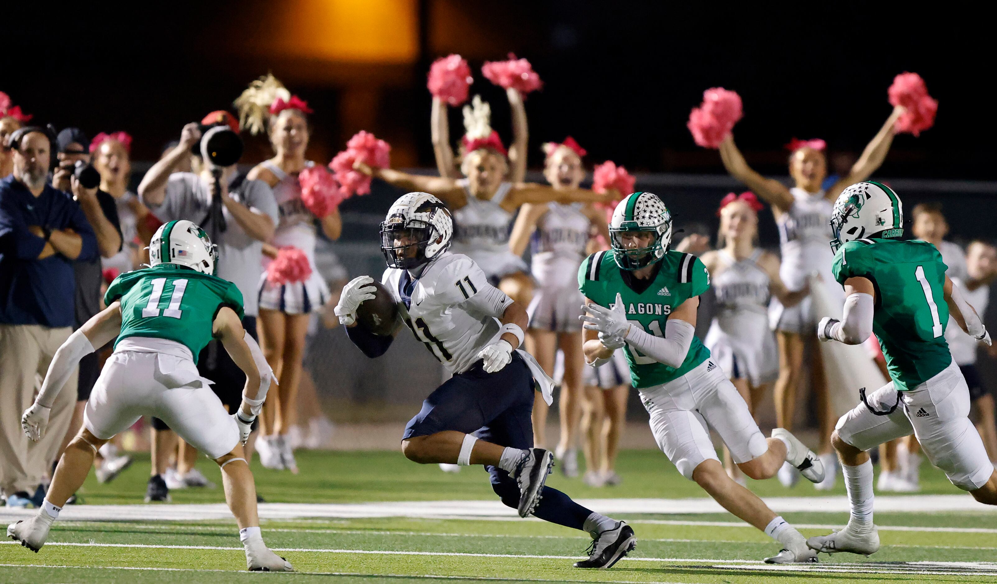 To the delight of the cheerleaders, Keller wide receiver Amarion Henry (11) turns up field...