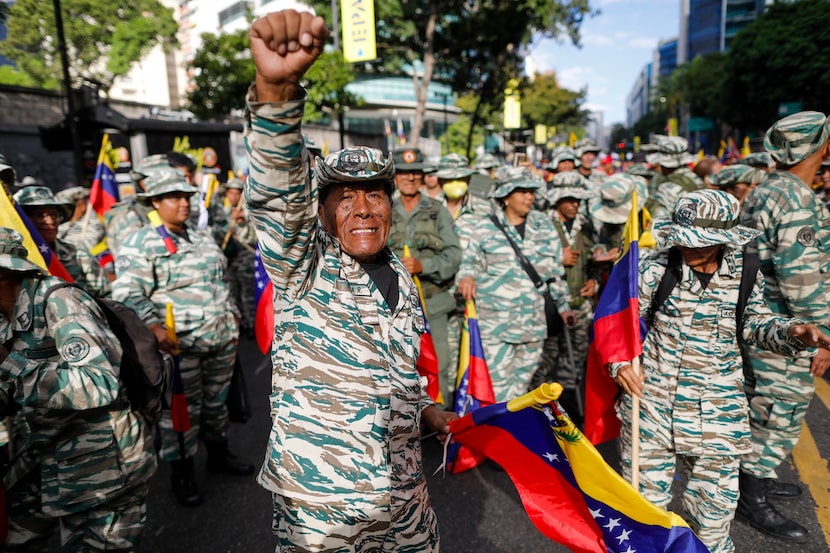 Government-backed militias march in Caracas, Venezuela, Thursday, Jan. 9, 2025, the day...