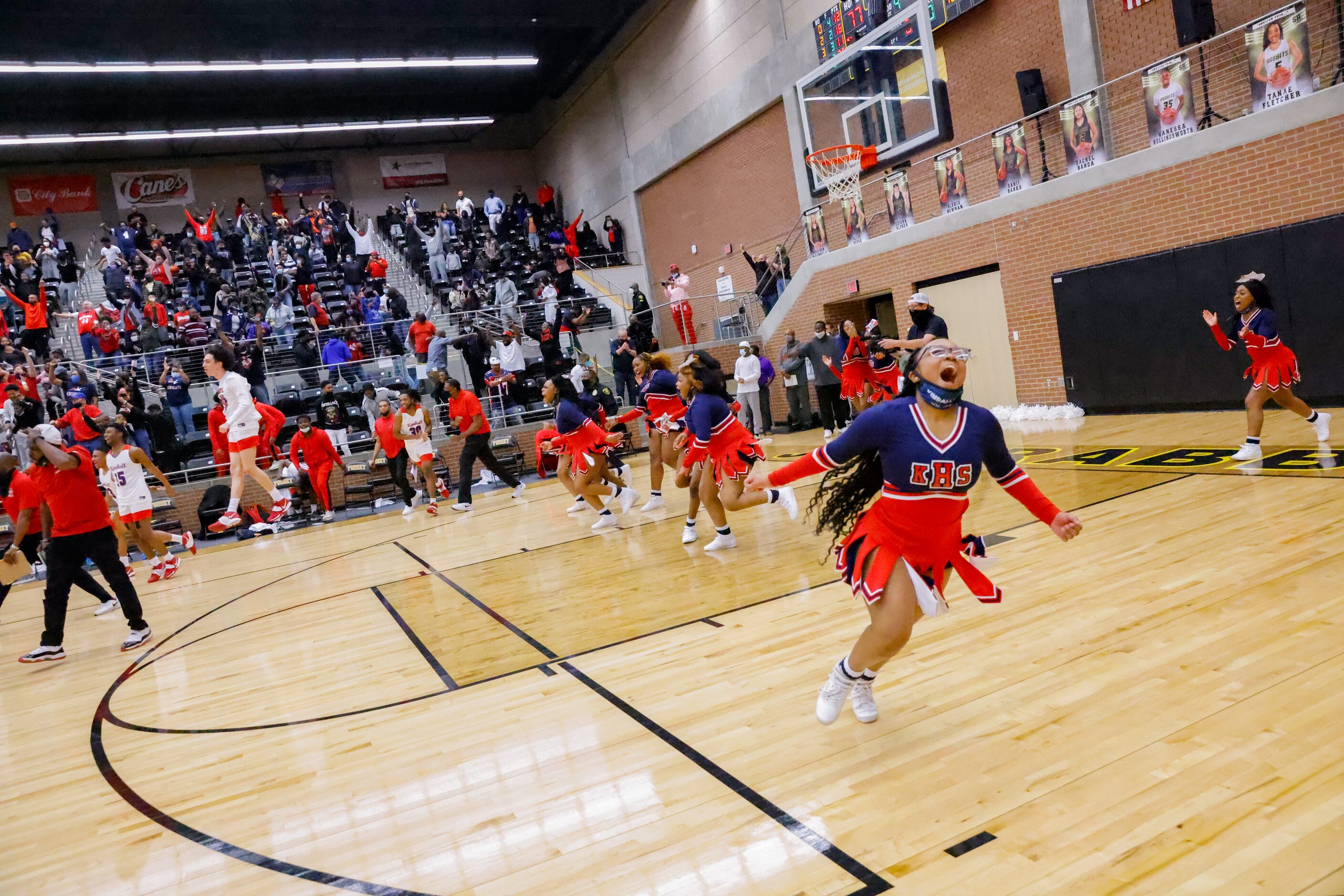 Kimball celebrates their win over Lancaster following overtime of a boys basketball UIL...