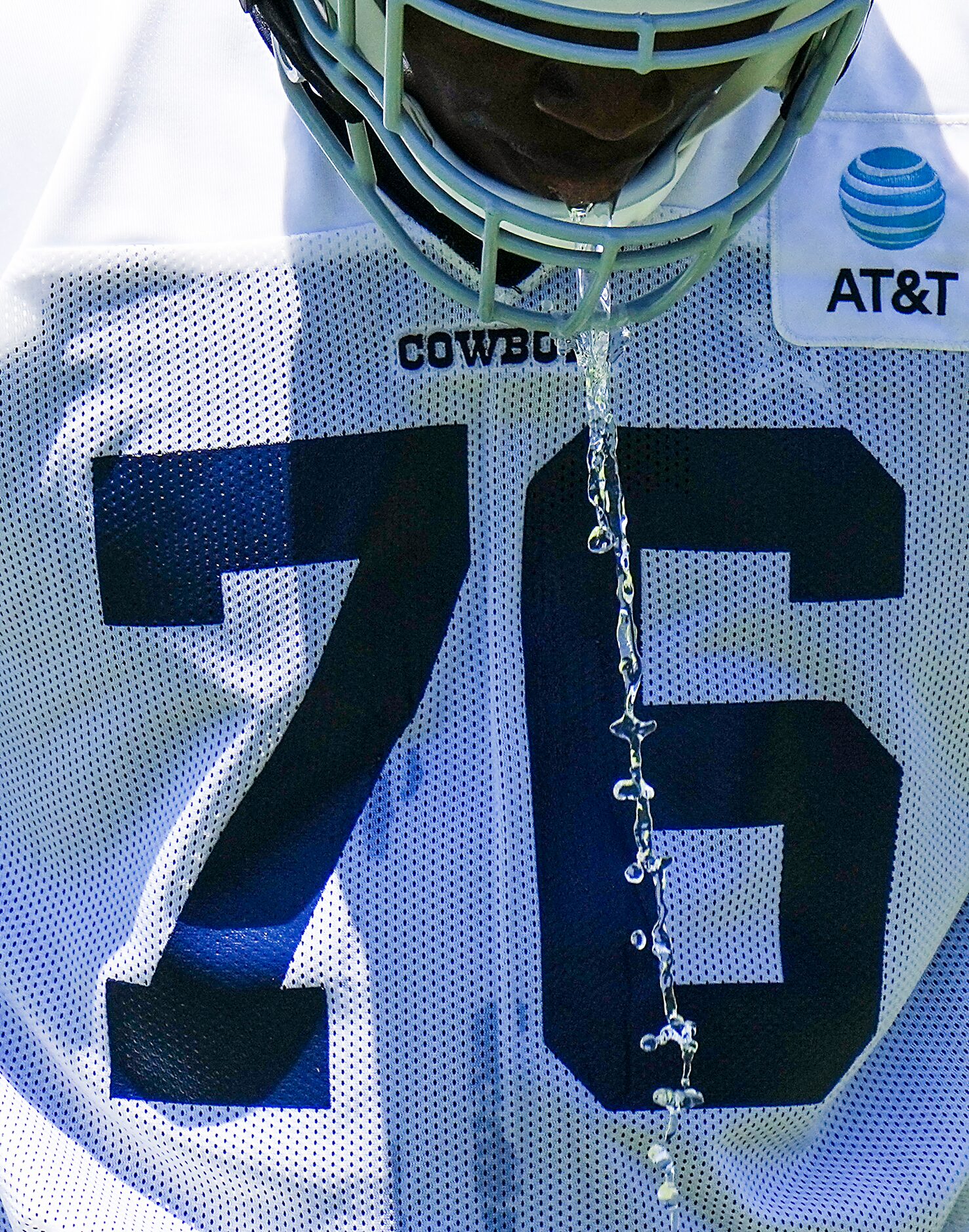 Dallas Cowboys offensive lineman Asim Richards cools off during a training camp practice on...