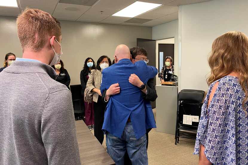 David Ricks hugs Jason Wu, who received a kidney from Ricks' daughter Ambriana after she...