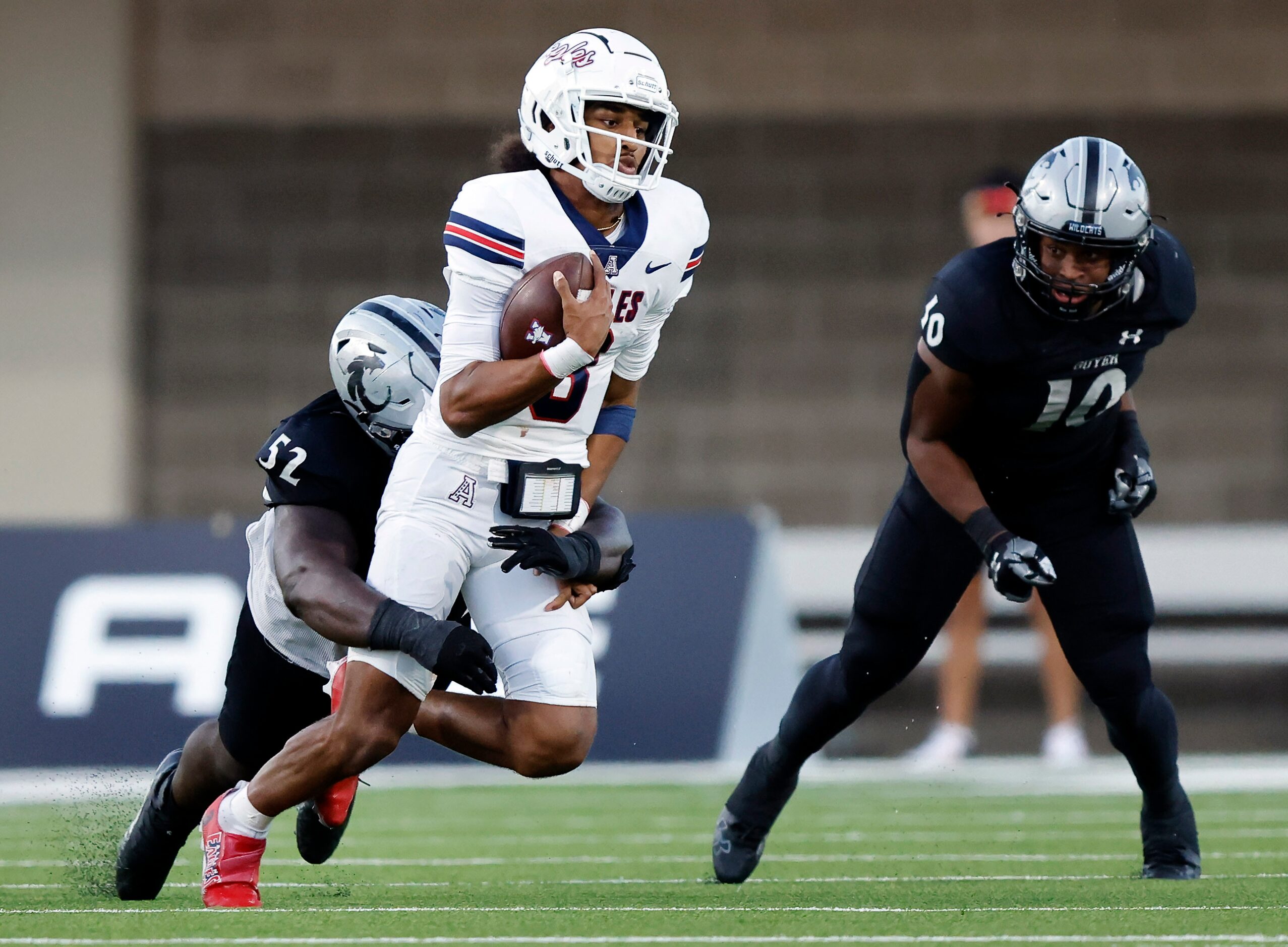 Denton Guyer Pelumi Olanipekun (52) sacks Allen quarterback Mike Hawkins (3) during the...